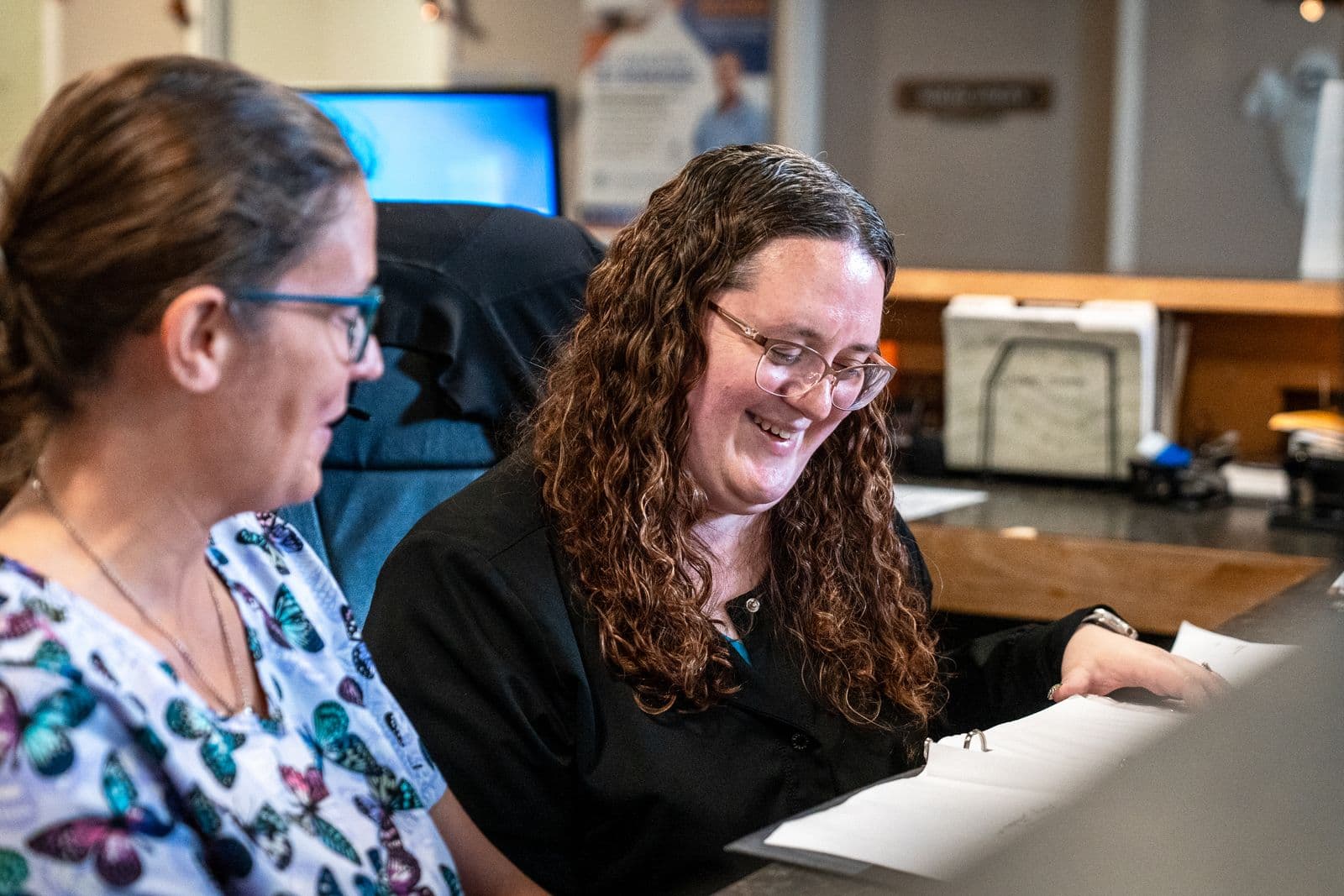 Staff members laughing together
